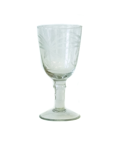 Wineglass with palm tree cut 